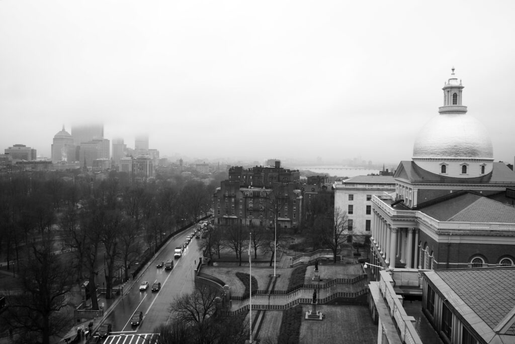 overlooking the city of boston on a rainy morning, showing the clouds and traffic