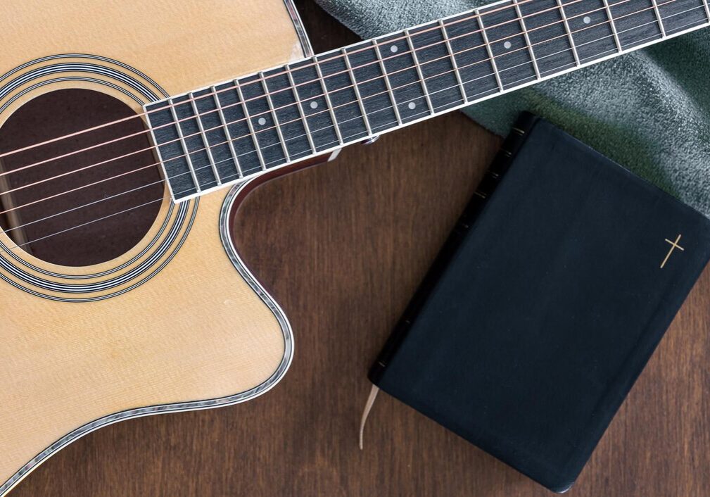 guitar-bible-book-wooden-background-top-view_169016-35117 guitar-bible-book-wooden-background-top-view_169016-35117