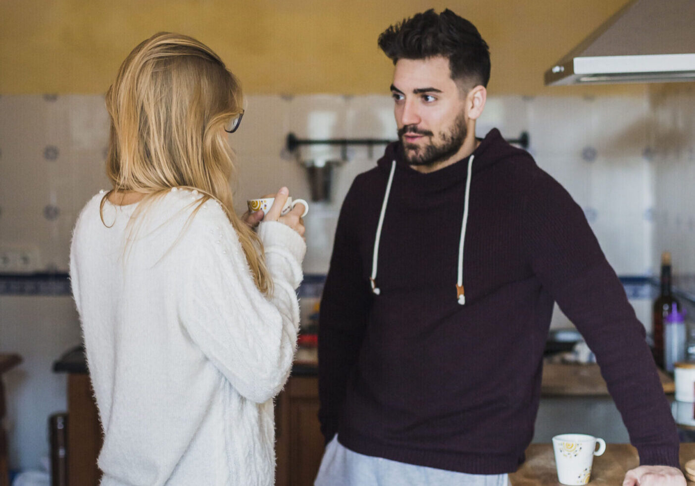 young-woman-man-talking-kitchen